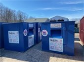 large blue recycling containers at municipal transfer station