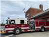 firetruck parked outside firehouse