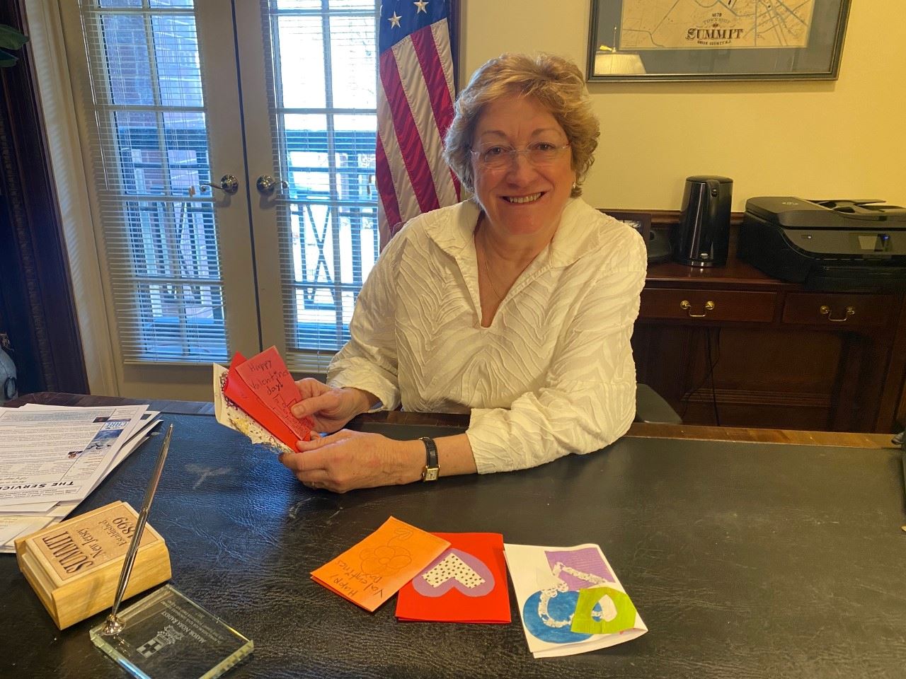 Summit Mayor Radest at her desk at city hall