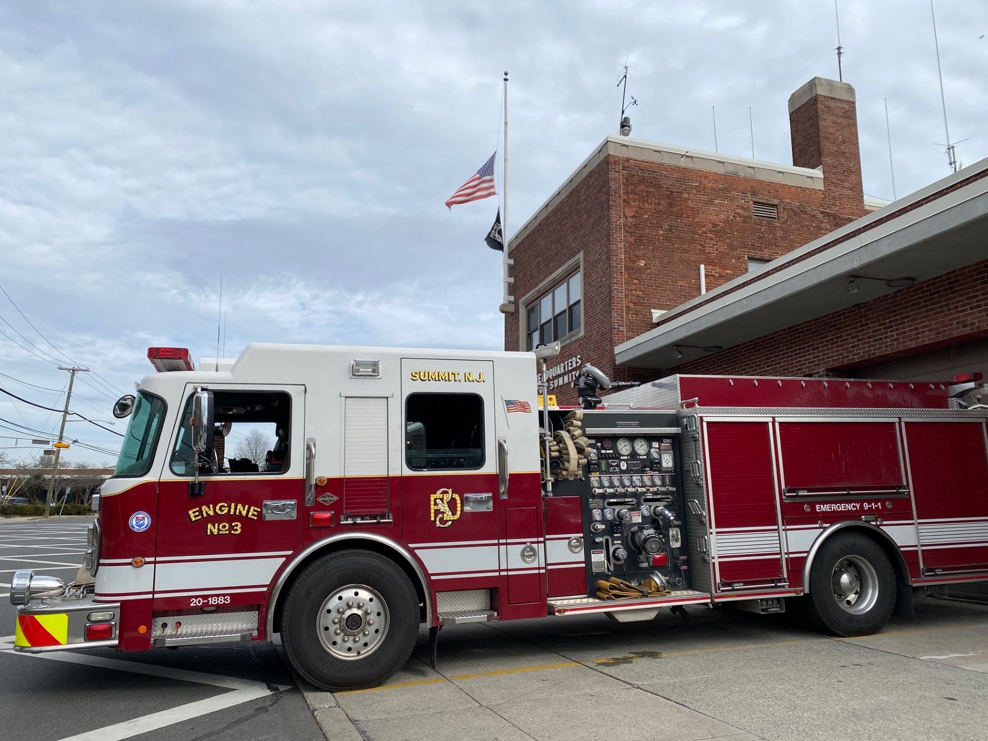 firetruck parked outside firehouse