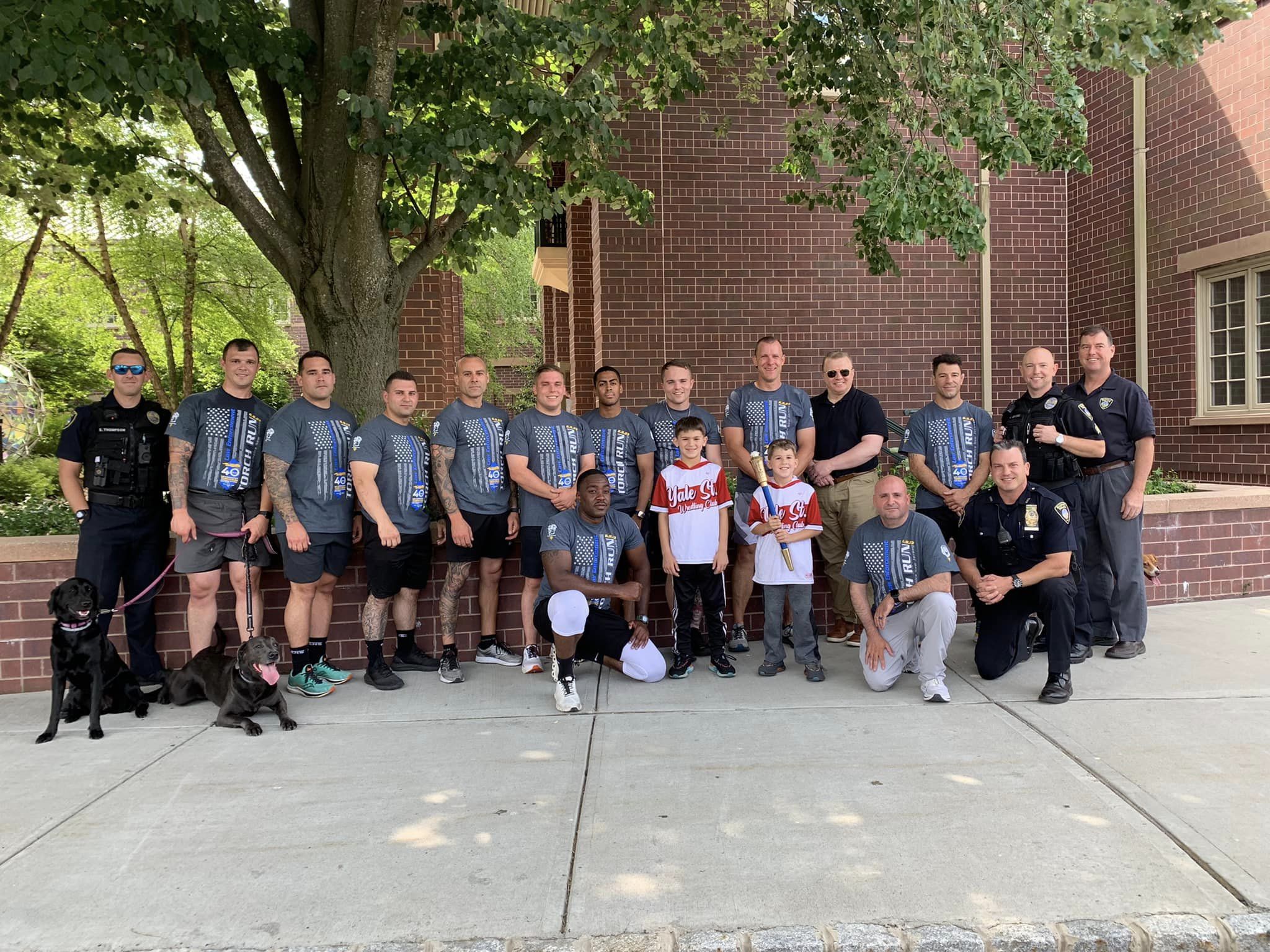police department group photo outside city hall for torch run