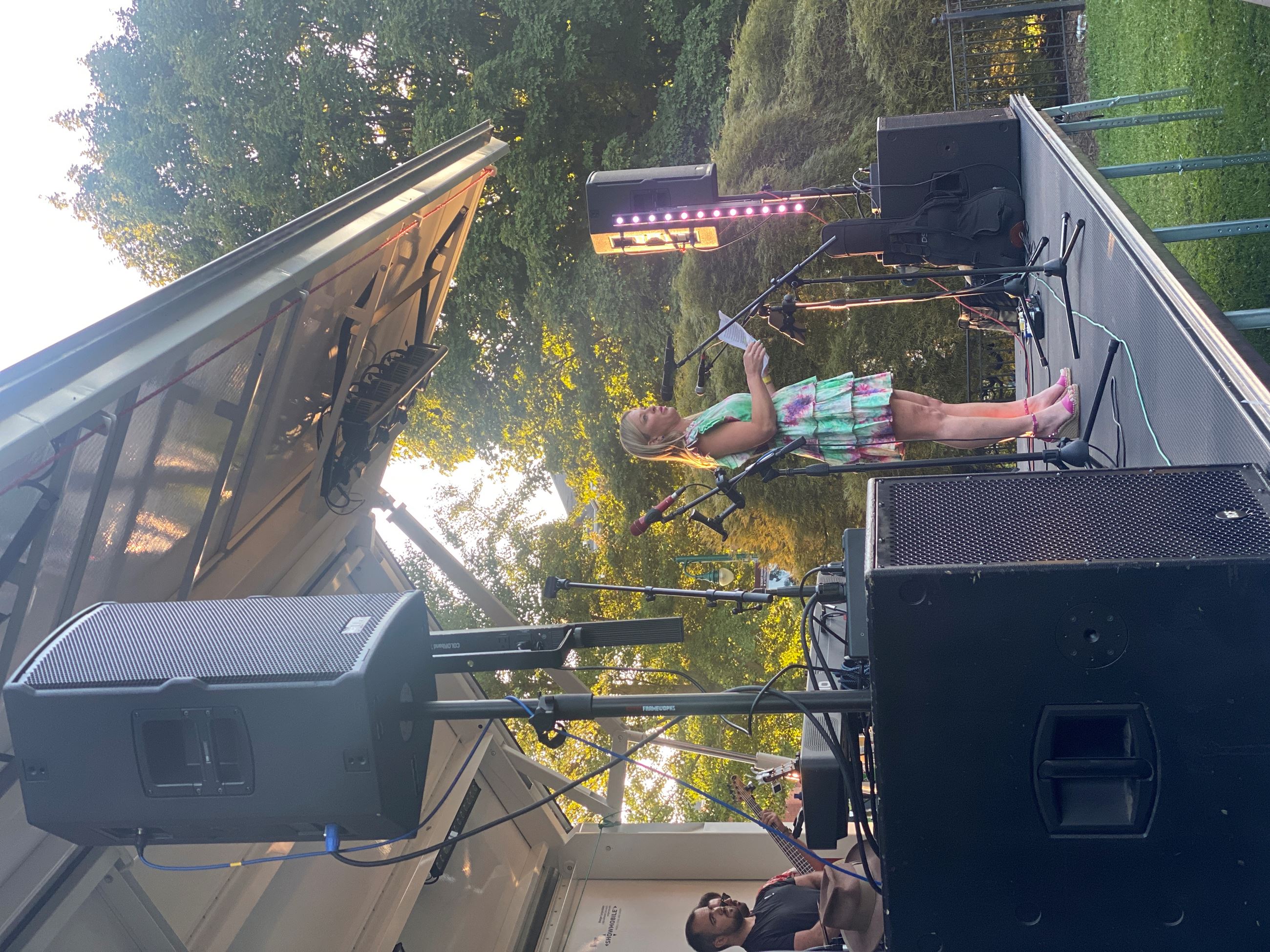 Councilmember on stage addressing crowd