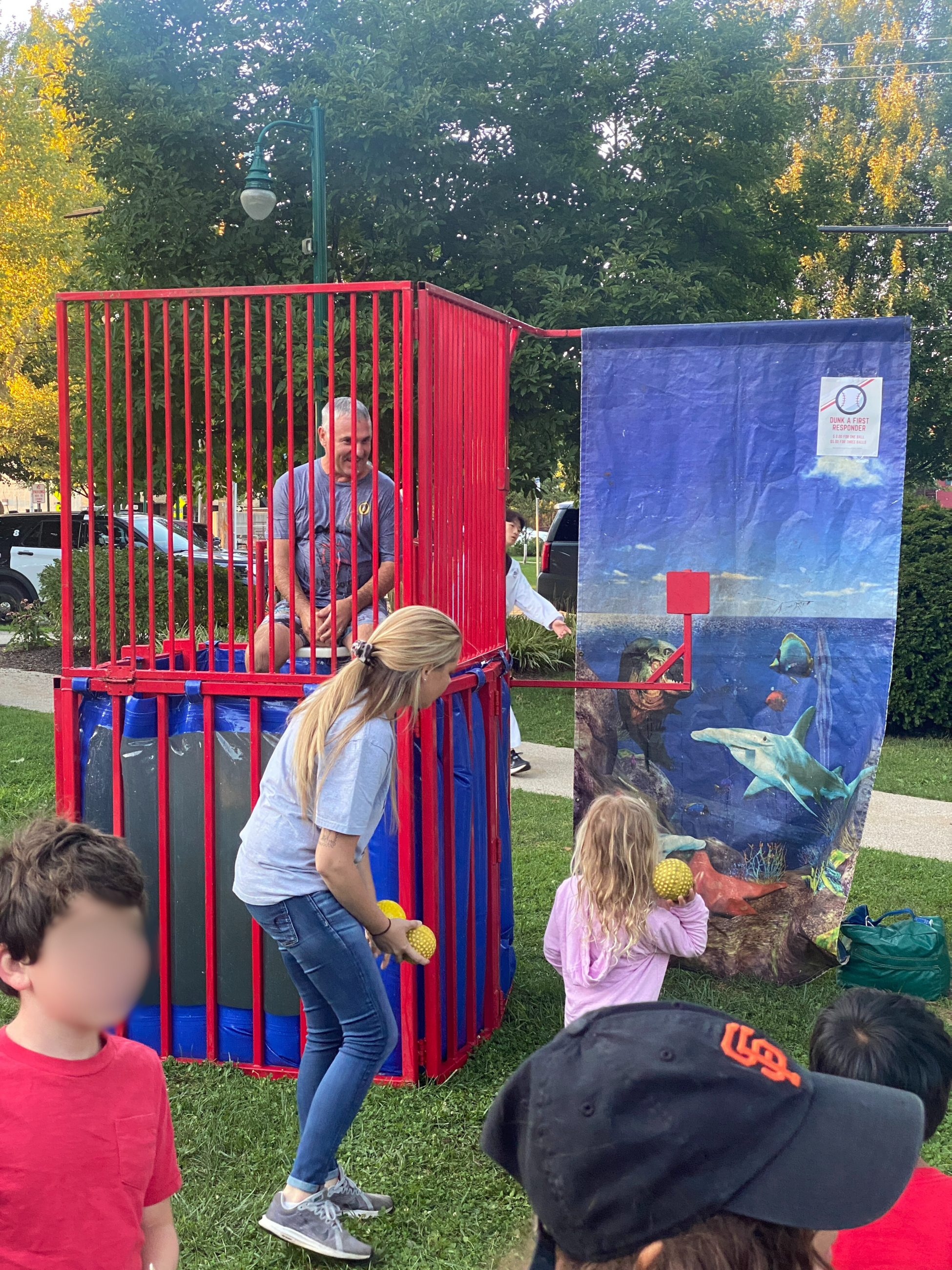 Child at dunk tank game
