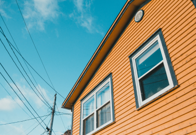 orange house with electrical wires nearby