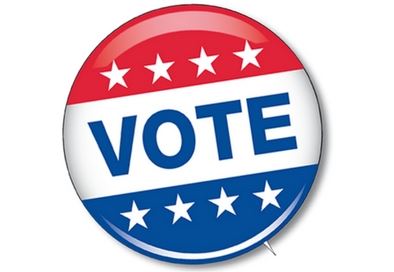 red white and blue button with the word vote in the middle