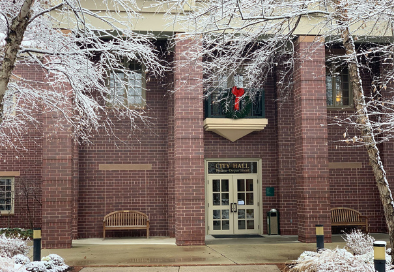 view of city hall from snowy courtyard