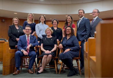 image of group of people posing for a photo in council chamber