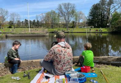 image of family from behind at fishing derby