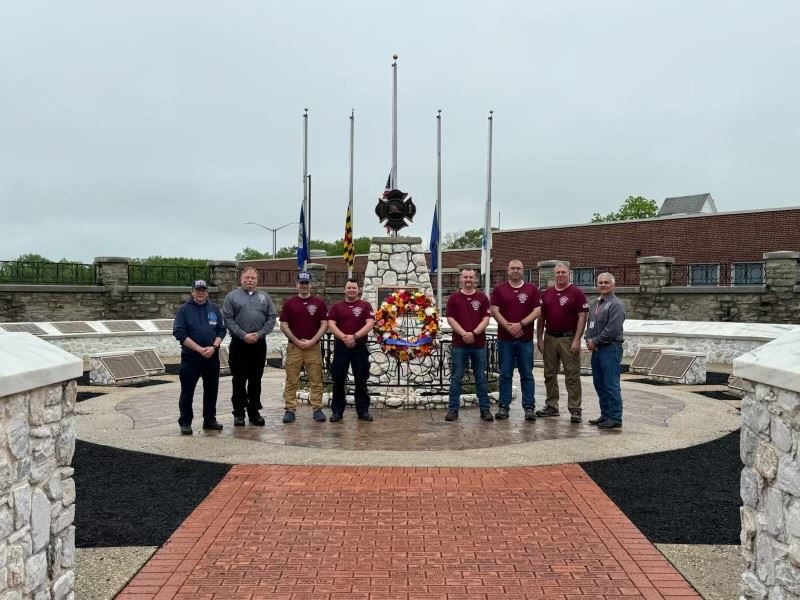 group photo of firefighters at memorial event